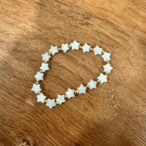 White and gold toned star bracelet​​​​​​​​